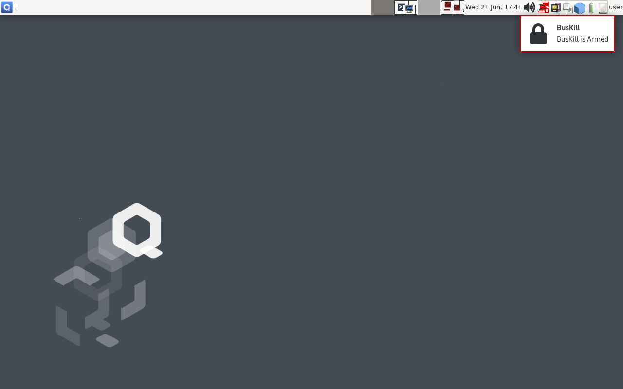 Screenshot of QubesOS with a toast message in the top-right that says \&quot;BusKill is Armed\&quot;