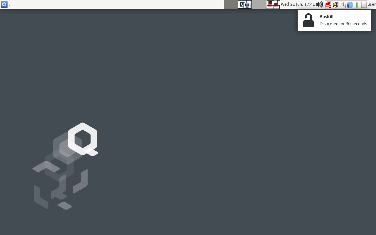 Screenshot of QubesOS with a toast message in the top-right that says \&quot;BusKill Disarmed for 30 Seconds\&quot;