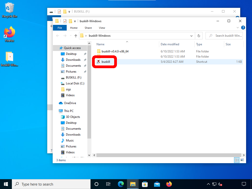 Screenshot shows the contents of the "buskill-Windows" folder on the user's Desktop. The executable for the App (named "buskll") is selected.